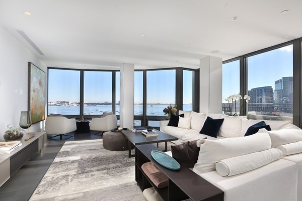 20 Rowes Wharf, Unit 610 Boston, MA 02110 - Photo 3 of 20 a living room with furniture and large windows