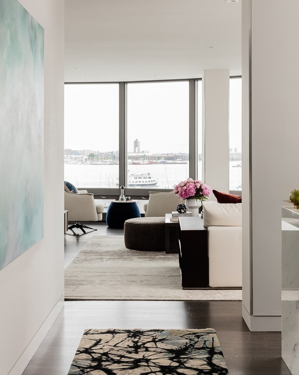20 Rowes Wharf, Unit 610 Boston, MA 02110 - Photo 5 of 20 a living room with furniture and a large window