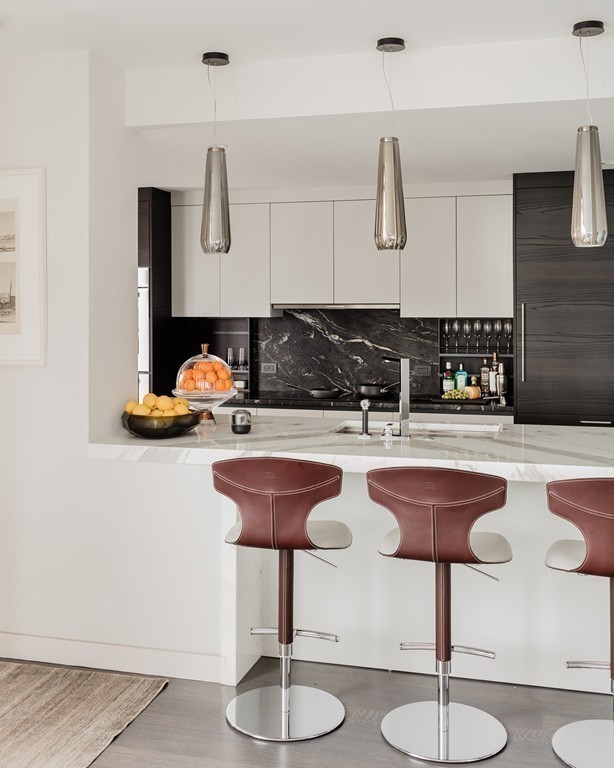 20 Rowes Wharf, Unit 610 Boston, MA 02110 - Photo 7 of 20 a kitchen with a sink and cabinets