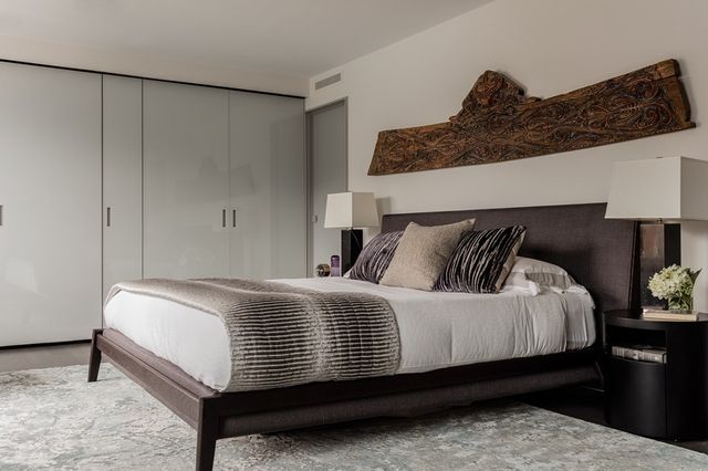 a bedroom with bed and window