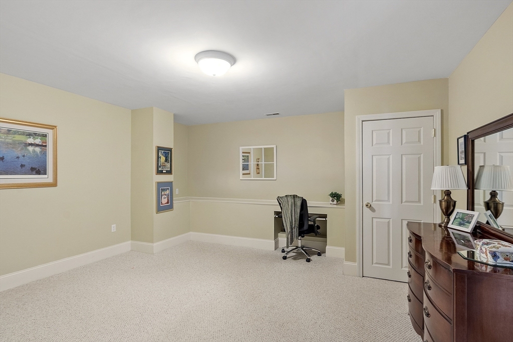 22 Hummock Way, Unit 22 Hudson, MA 01749 - Photo 16 of 23 a view of a room with gym equipment