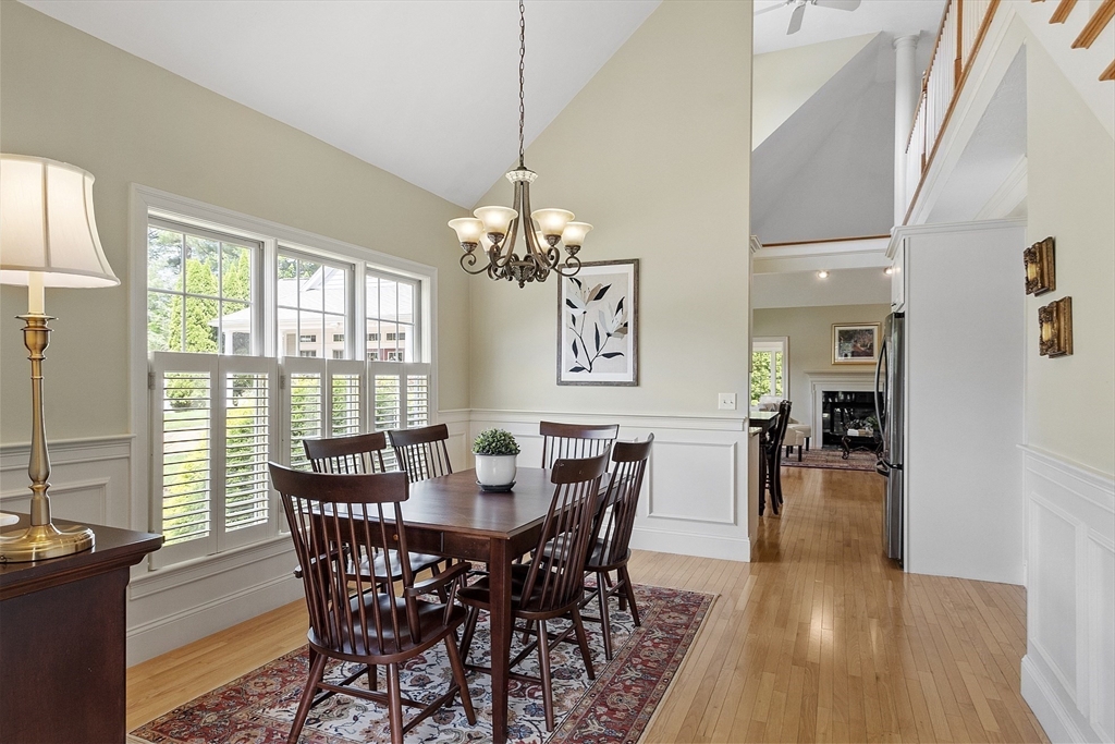 22 Hummock Way, Unit 22 Hudson, MA 01749 - Photo 19 of 23 a view of a dining room with furniture window and wooden floor