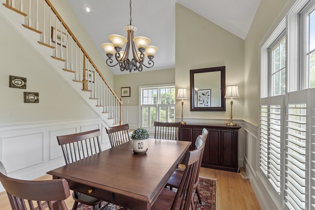 22 Hummock Way, Unit 22 Hudson, MA 01749 - Photo 20 of 23 a view of a dining room with furniture window and wooden floor