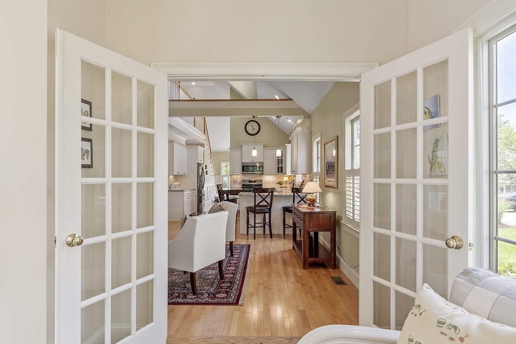 22 Hummock Way, Unit 22 Hudson, MA 01749 - Photo 10 of 23 a living room with furniture and a large window