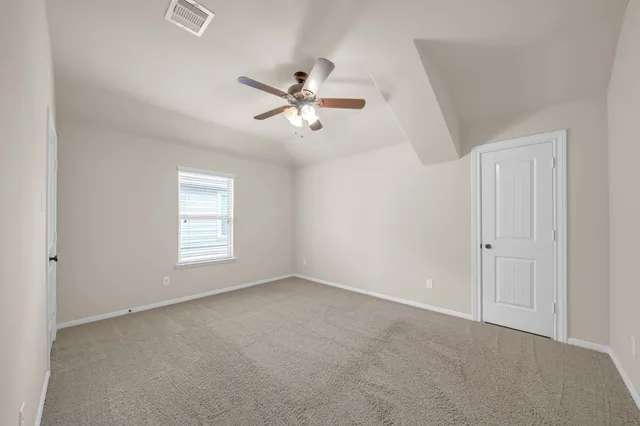 a view of empty room with windows