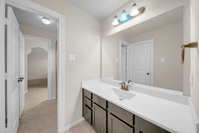 a bathroom with a sink double vanity and a mirror
