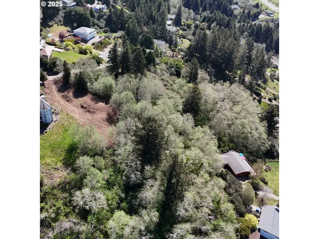 a backyard of a house with a yard and outdoor seating