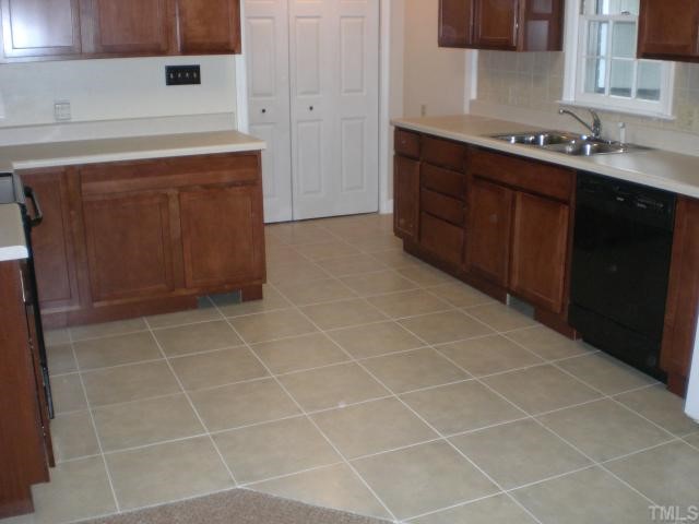 3113 Sherry Drive Raleigh, NC 27604 - Photo 3 of 12 a bathroom with a sink vanity and a mirror