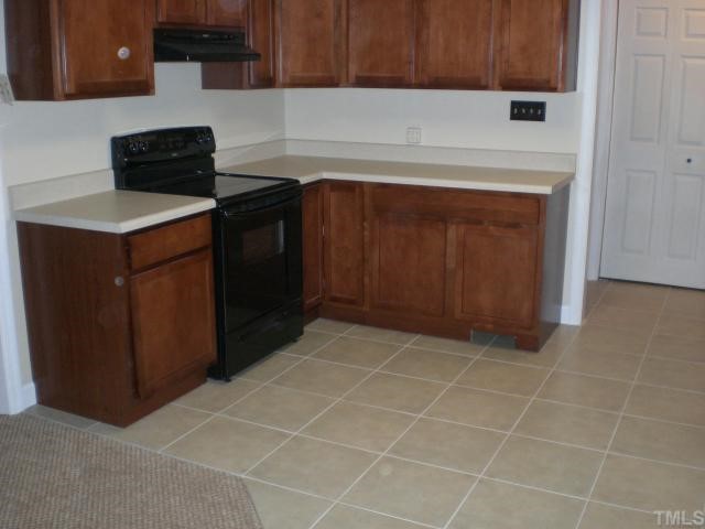 3113 Sherry Drive Raleigh, NC 27604 - Photo 5 of 12 a kitchen with a sink and a cabinets