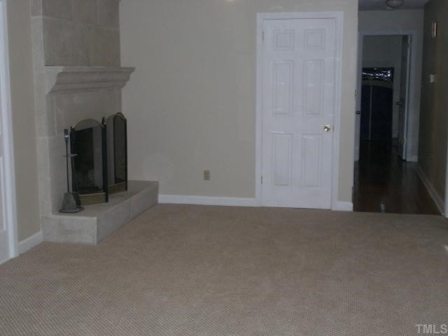 3113 Sherry Drive Raleigh, NC 27604 - Photo 7 of 12 a view of an empty room with closet and a fireplace
