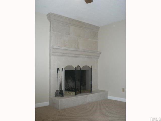 3113 Sherry Drive Raleigh, NC 27604 - Photo 8 of 12 a living room with furniture and a fireplace