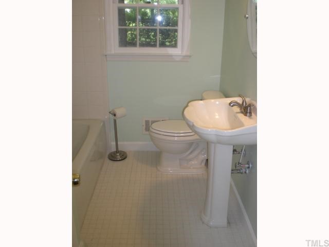 3113 Sherry Drive Raleigh, NC 27604 - Photo 9 of 12 a bathroom with a sink and a toilet