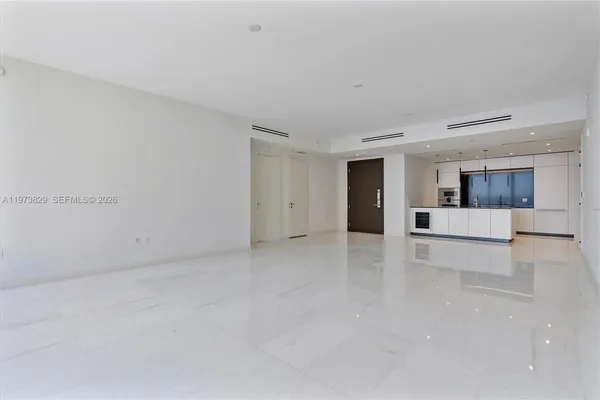 a large white room with kitchen