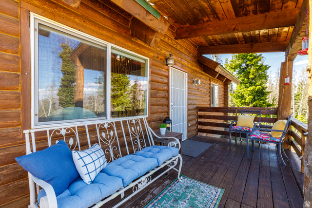 706 Tranquility Drive Springdale, UT 84767 - Photo 4 of 55 Covered Porch Lounge: Relax on the covered portion of the wrap-around deck with comfortable seating.