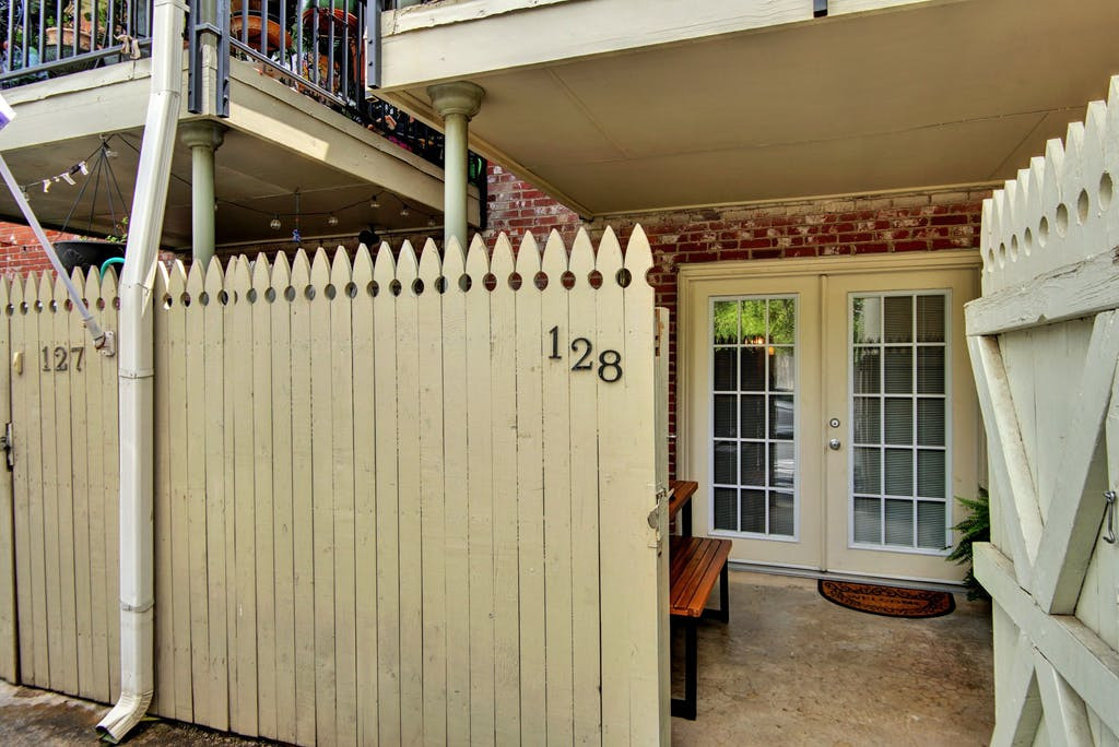 7920 Rockwood Lane, Unit 128 Austin, TX 78757 - Photo 26 of 36 a view of a porch with a door and wooden walls