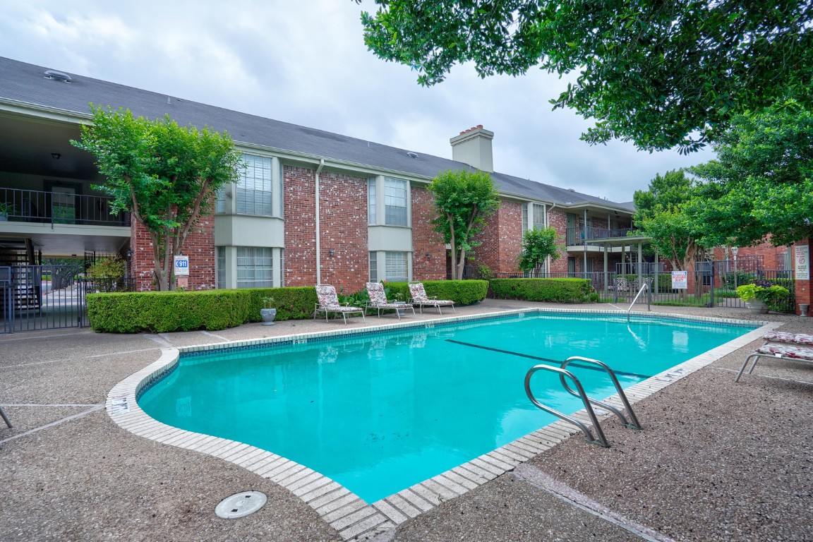 7920 Rockwood Lane, Unit 128 Austin, TX 78757 - Photo 29 of 36 a view of a house with swimming pool and yard