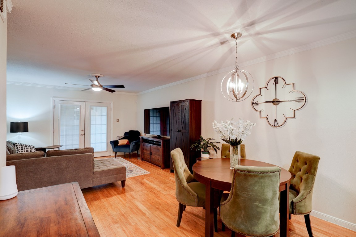 7920 Rockwood Lane, Unit 128 Austin, TX 78757 - Photo 6 of 36 a living room with furniture or chandelier and a wooden floor
