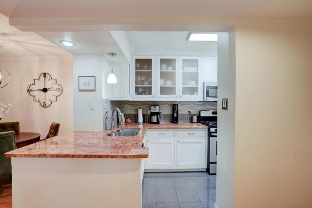 a view of a kitchen and a sink
