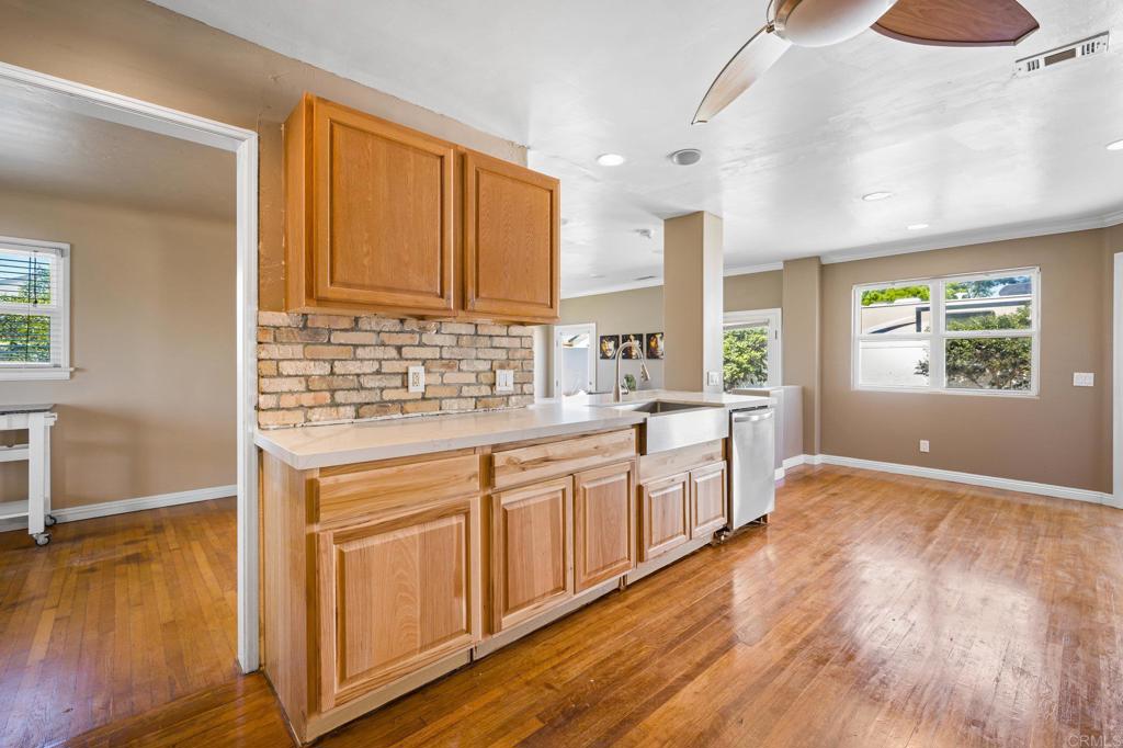 2548 Mesa Drive Oceanside, CA 92054 - Photo 11 of 33 a kitchen with stainless steel appliances granite countertop a stove a sink and a refrigerator