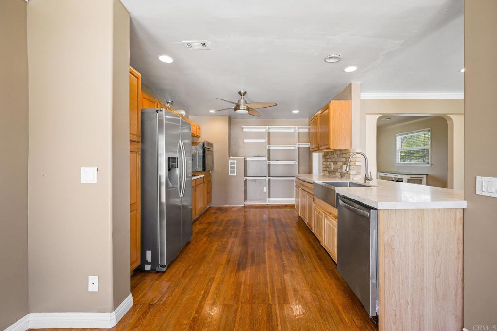 2548 Mesa Drive Oceanside, CA 92054 - Photo 13 of 33 a view of a kitchen cabinets and wooden floor