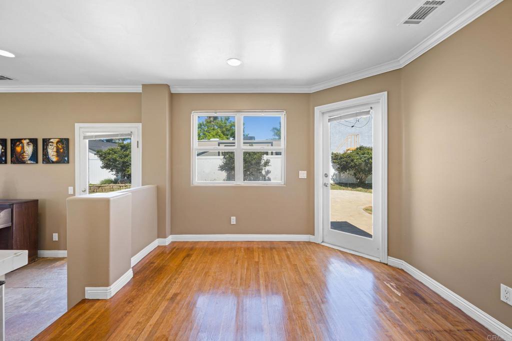 2548 Mesa Drive Oceanside, CA 92054 - Photo 14 of 33 a view of empty room with wooden floor and fan
