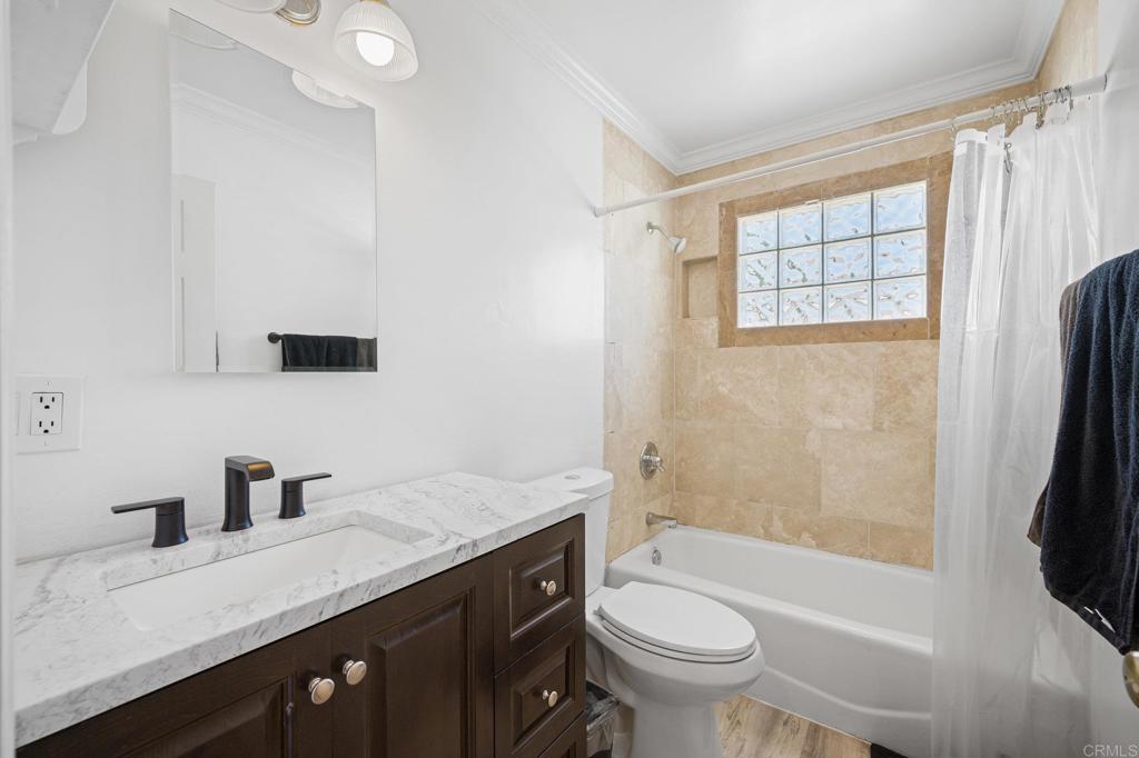 2548 Mesa Drive Oceanside, CA 92054 - Photo 16 of 33 a bathroom with a granite countertop sink toilet and shower