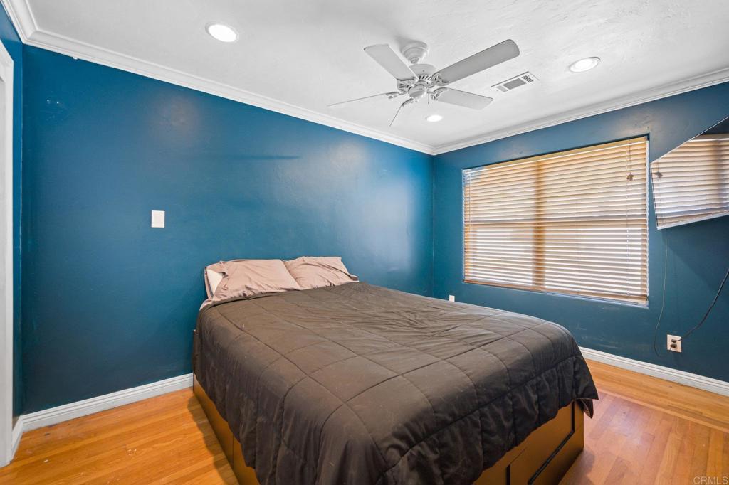 2548 Mesa Drive Oceanside, CA 92054 - Photo 17 of 33 a bedroom with a bed and window