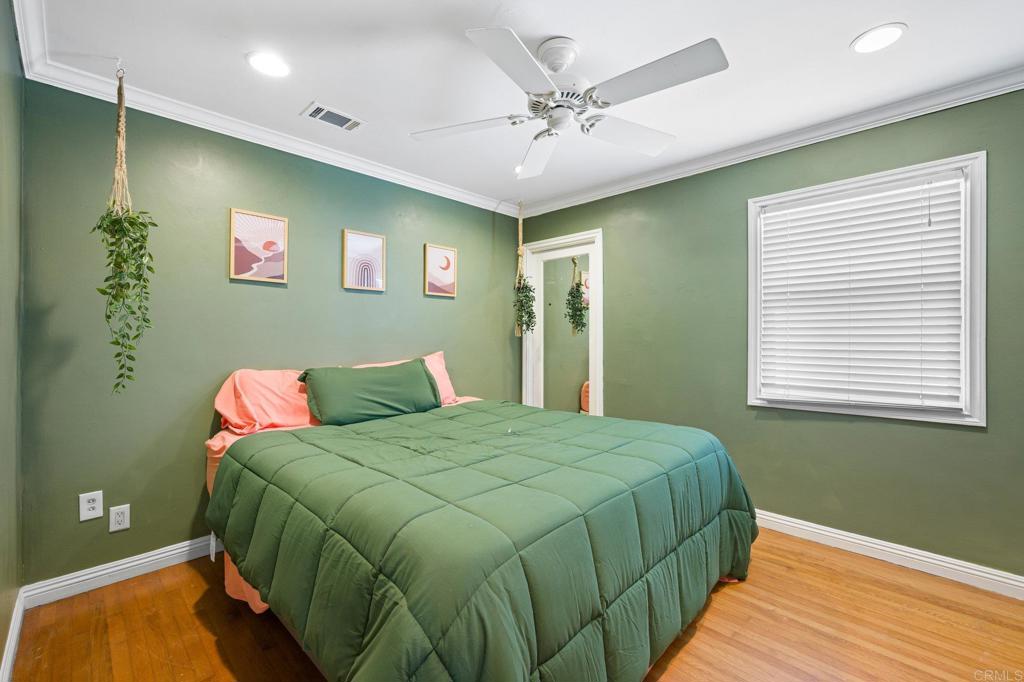 2548 Mesa Drive Oceanside, CA 92054 - Photo 18 of 33 a bedroom with a bed and a window