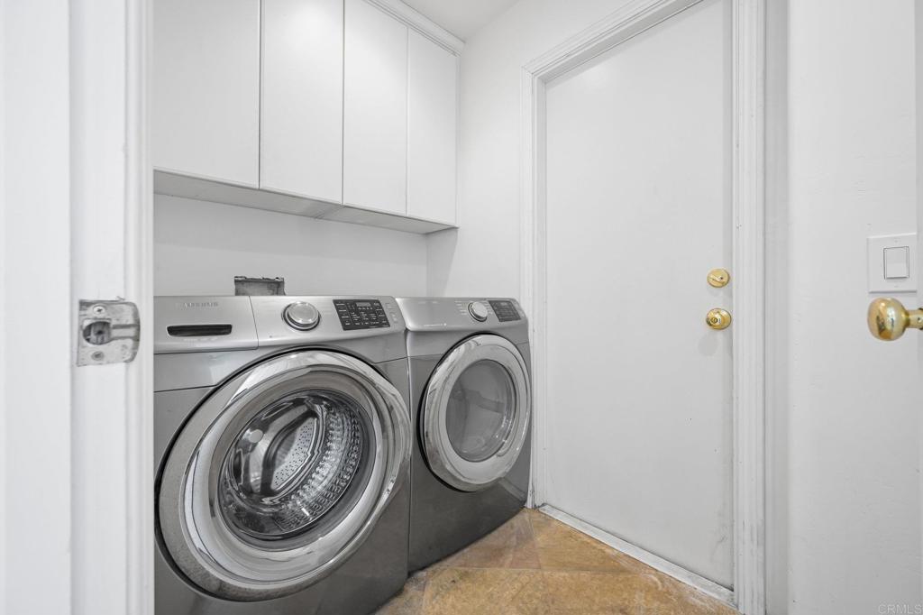 2548 Mesa Drive Oceanside, CA 92054 - Photo 23 of 33 a view of storage and utility room with washer and dryer
