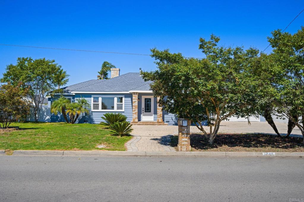 2548 Mesa Drive Oceanside, CA 92054 - Photo 3 of 33 a front view of a house with a yard
