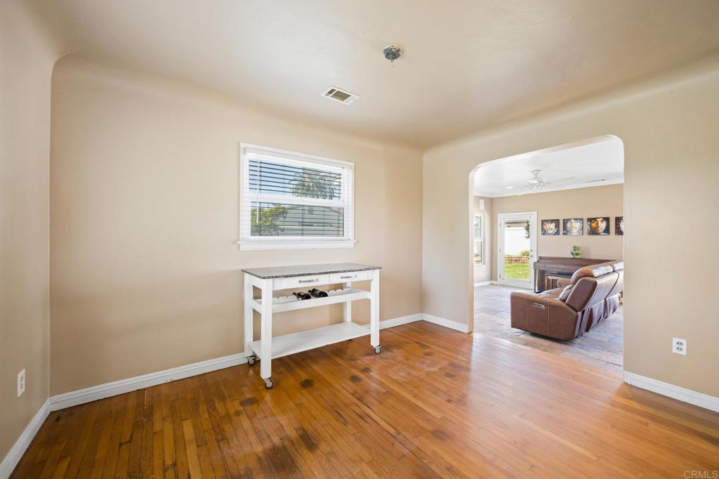 2548 Mesa Drive Oceanside, CA 92054 - Photo 6 of 33 a room with furniture and a wooden floor