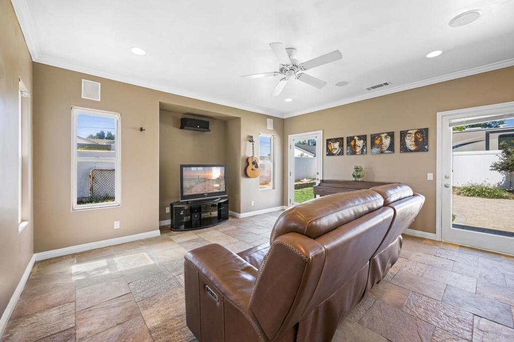 2548 Mesa Drive Oceanside, CA 92054 - Photo 7 of 33 a living room with furniture and a flat screen tv