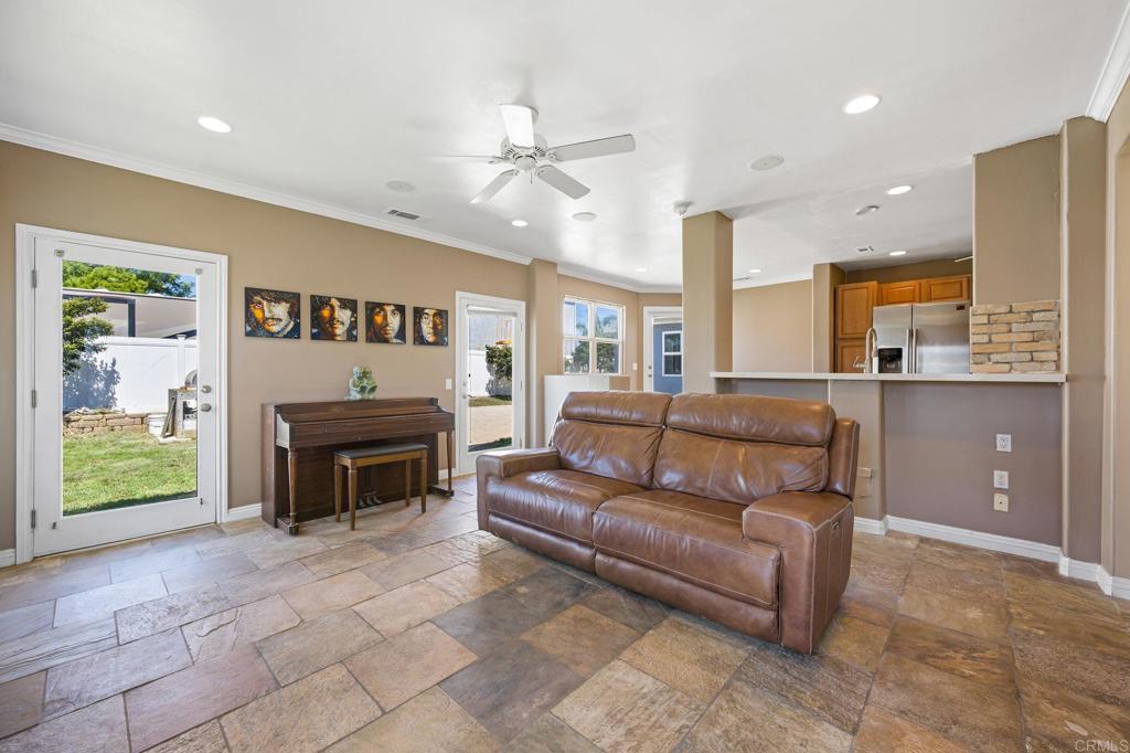 2548 Mesa Drive Oceanside, CA 92054 - Photo 8 of 33 a living room with furniture and a fireplace