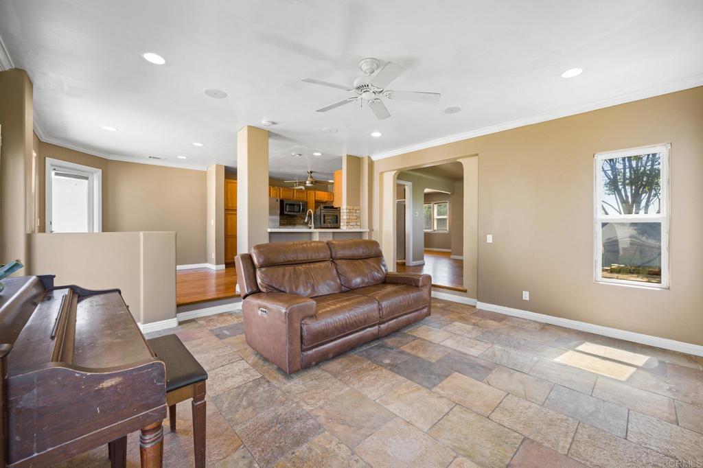 2548 Mesa Drive Oceanside, CA 92054 - Photo 9 of 33 a living room with furniture and a chandelier