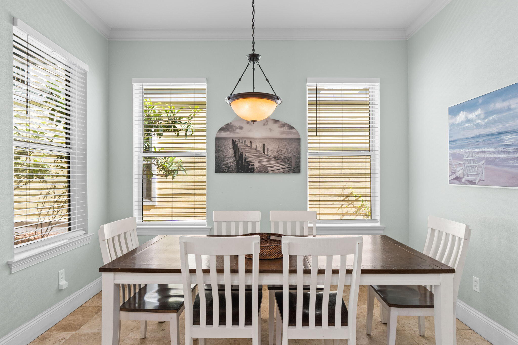 209 Grand Key Loop East Destin, FL 32541 - Photo 10 of 59 a dining room with wooden floor and a chandelier