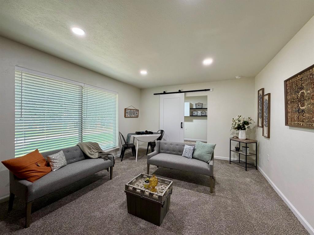 3609 Country Club Road Arlington, TX 76013 - Photo 17 of 40 a living room with furniture and a wooden floor