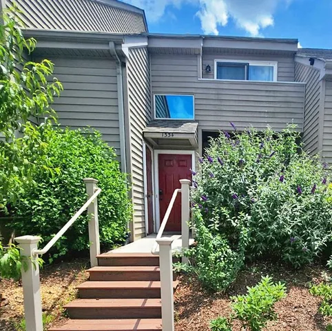 a front view of a house with stairs