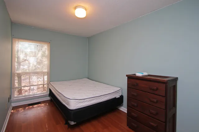 a room with bed and window