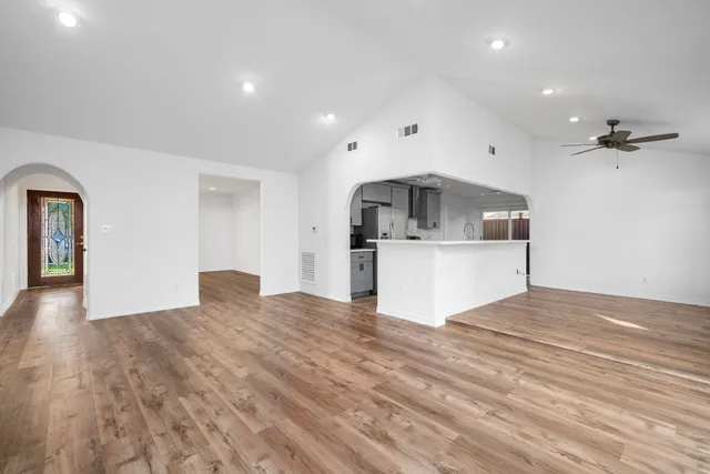 a view of a kitchen with a sink and cabinets
