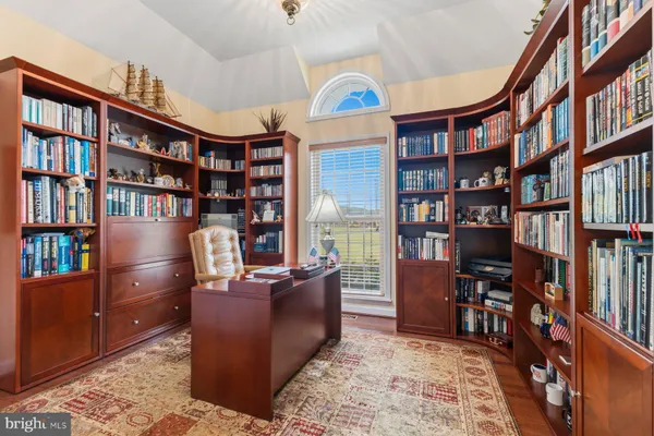 a bed room with a bed and windows