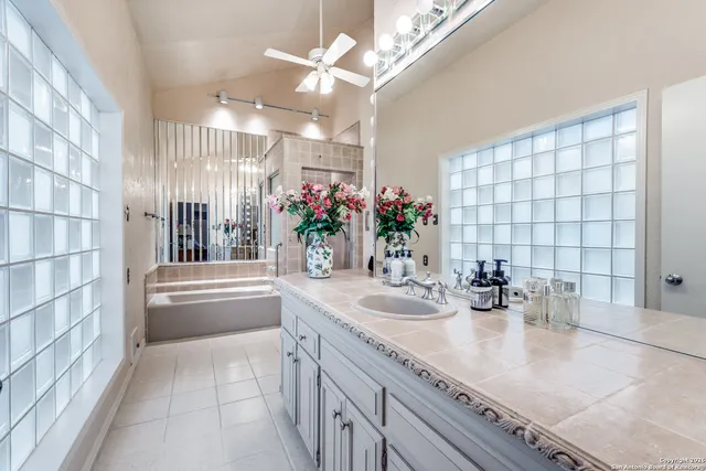 a bathroom with a bathtub and a shower