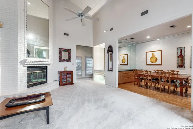 a kitchen with stainless steel appliances wooden cabinets a stove a sink and a refrigerator