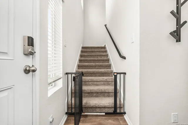 a view of staircase with white walls