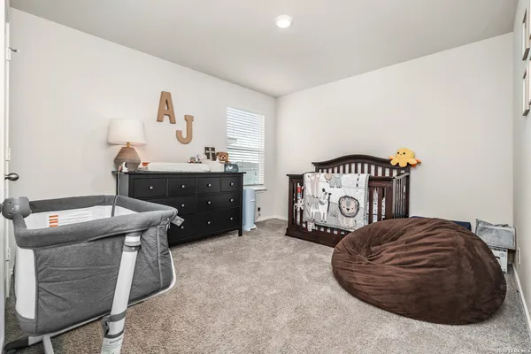 a bedroom with a bed and a table in it