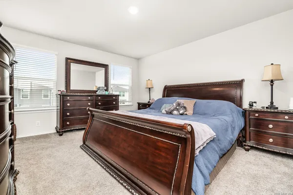 a bedroom with a bed and furniture