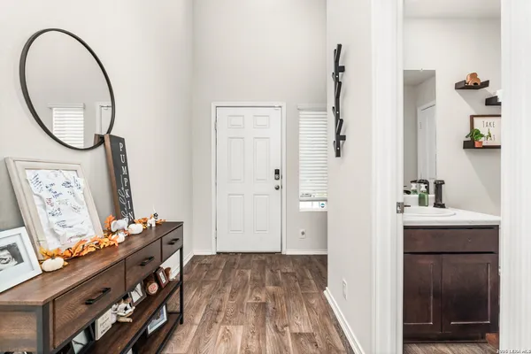 a view of an entryway with wooden floor