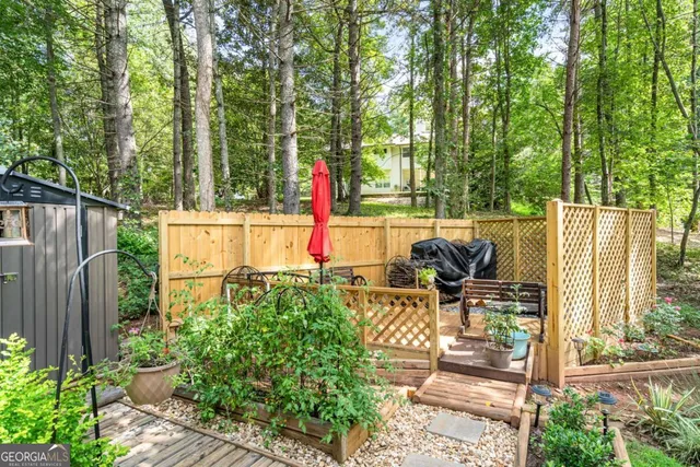 a living room with furniture fireplace and a large window