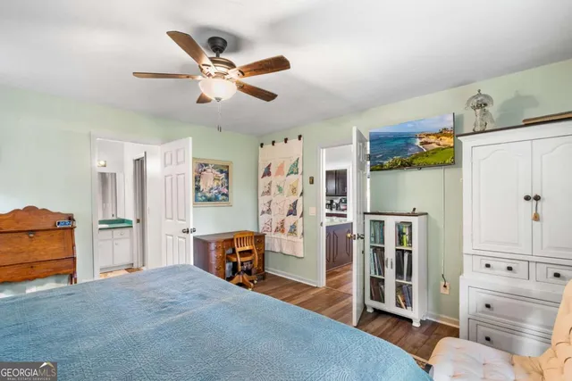 a view of a house with yard and sitting area