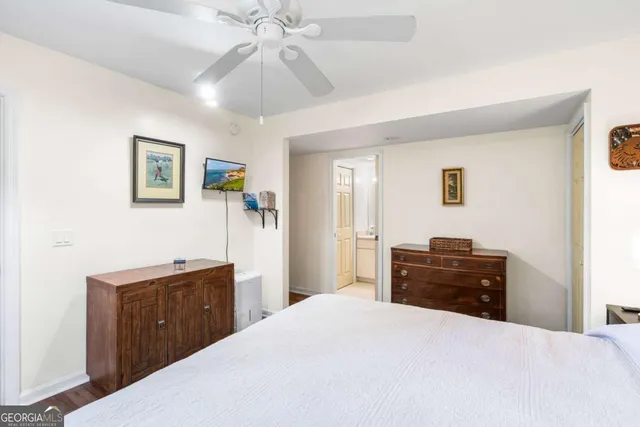 a view of a lush green forest with a houses