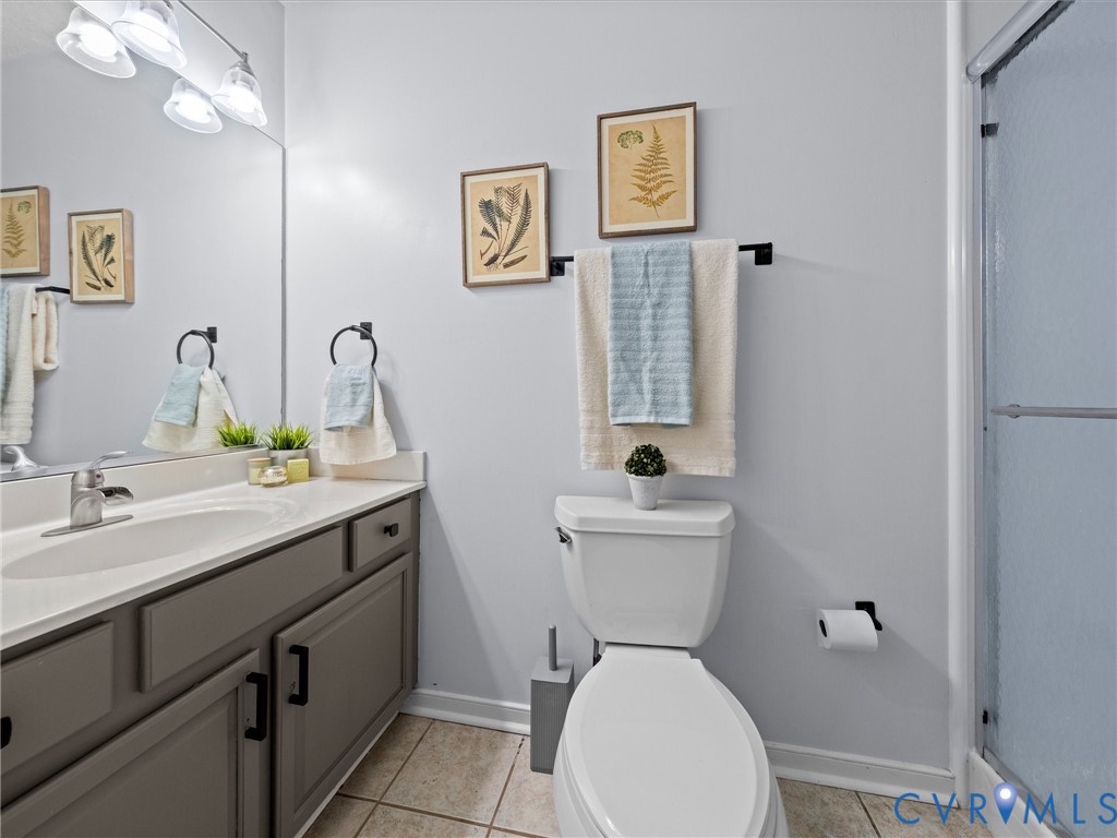 6712 Hedges Road Richmond, VA 23224 - Photo 23 of 34 Bathroom featuring a vanity with a white counterto